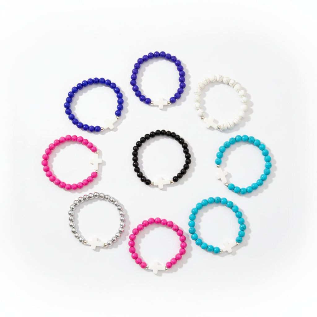 Cross bracelets in multiple colors flat lay on white background